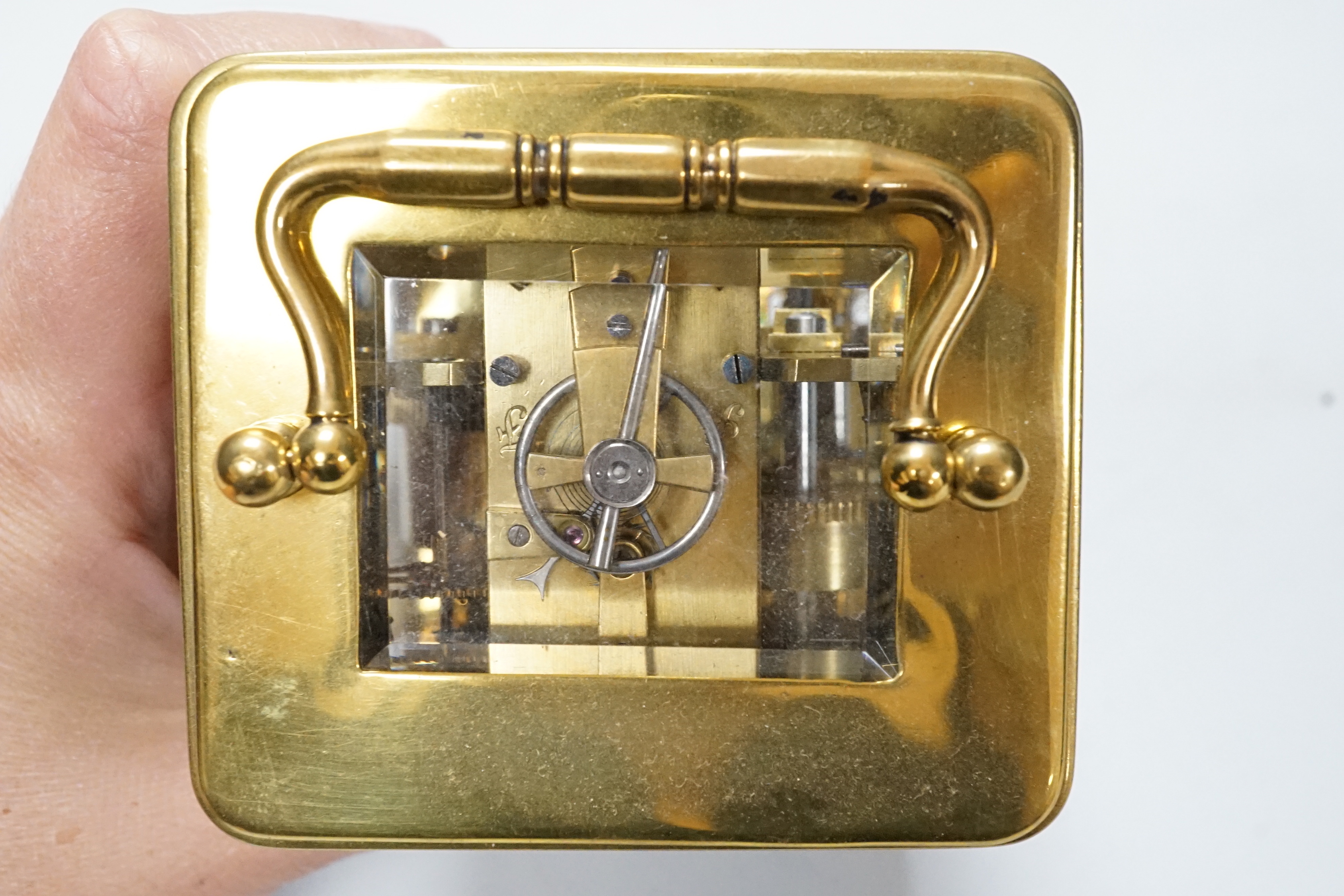 A cased carriage timepiece with alarm